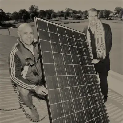 men holdingsolar panel